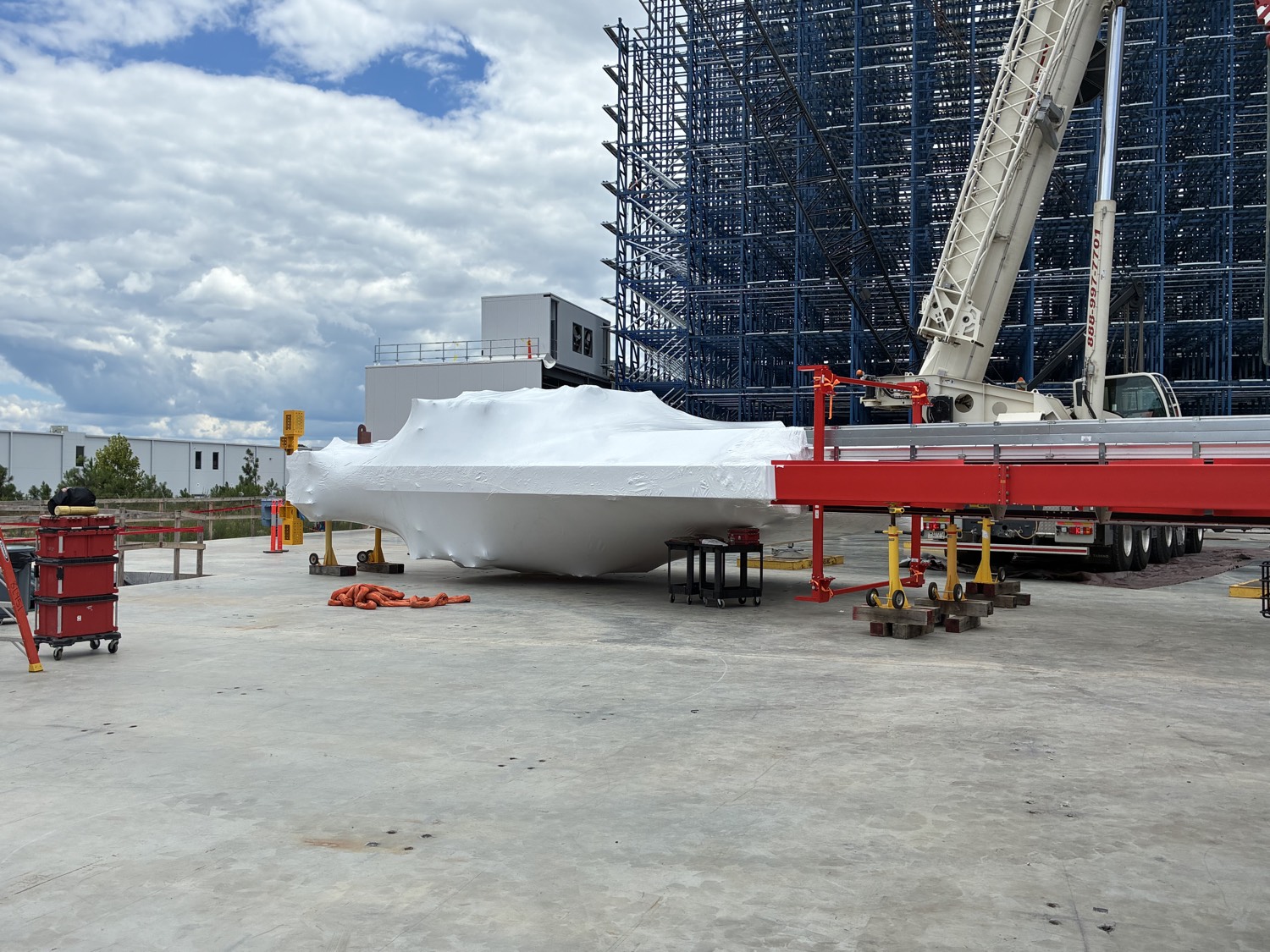 Large assembly under shrink wrap at facility